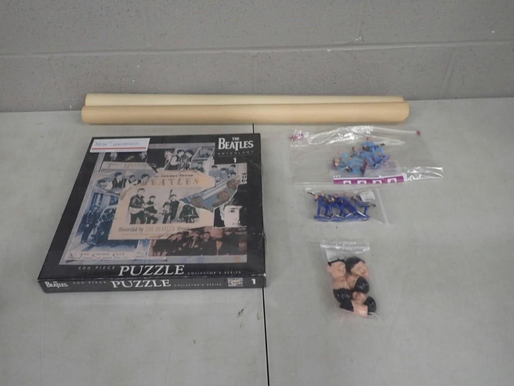 The Beatles Lot including Puzzle, Poster, Figurines: The Beatles Lot including Puzzle, Poster - measures roughly 25x30", Figurines All pictures are considered part of the description and should be examined carefully by bidders. Live Auctioneers is n