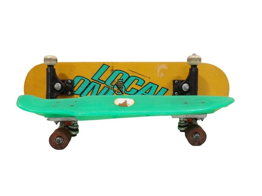 Two Skateboards including Locals Only and a Green Plastic one: Two Skateboards including Locals Only and a Green Plastic one All pictures are considered part of the description and should be examined carefully by bidders. Live Auctioneers is now offering Live Shi