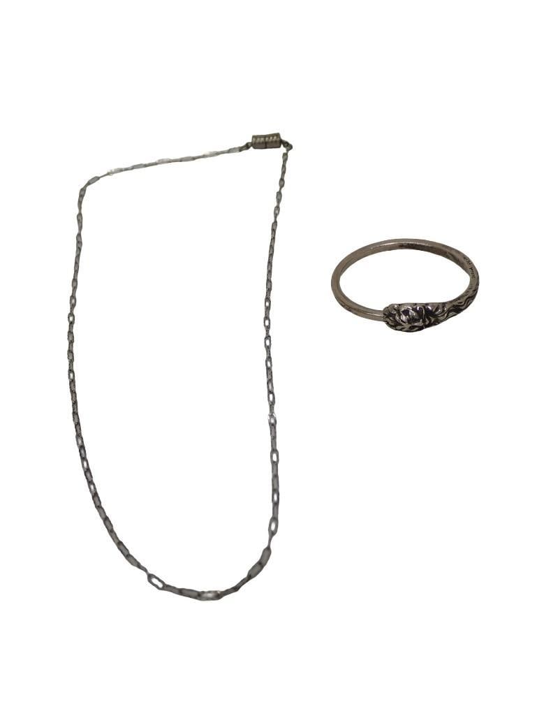 Sterling Silver Very Small Bracelet or Very Large Ring and a Small Chain: Sterling Silver Very Small Bracelet or Very Large Ring (I think this might be a bracelet for an extremely small child or maybe a baby) and a Small Chain. The bracelet is marked sterling and the