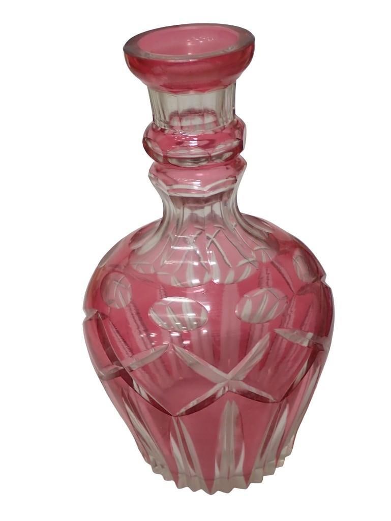 Vintage Cut to Clear Cranberry Glass Decanter: Vintage Cut to Clear Cranberry Glass Decanter Condition: no stopper All pictures are considered part of the description and should be examined carefully by bidders. Live Auctioneers is n