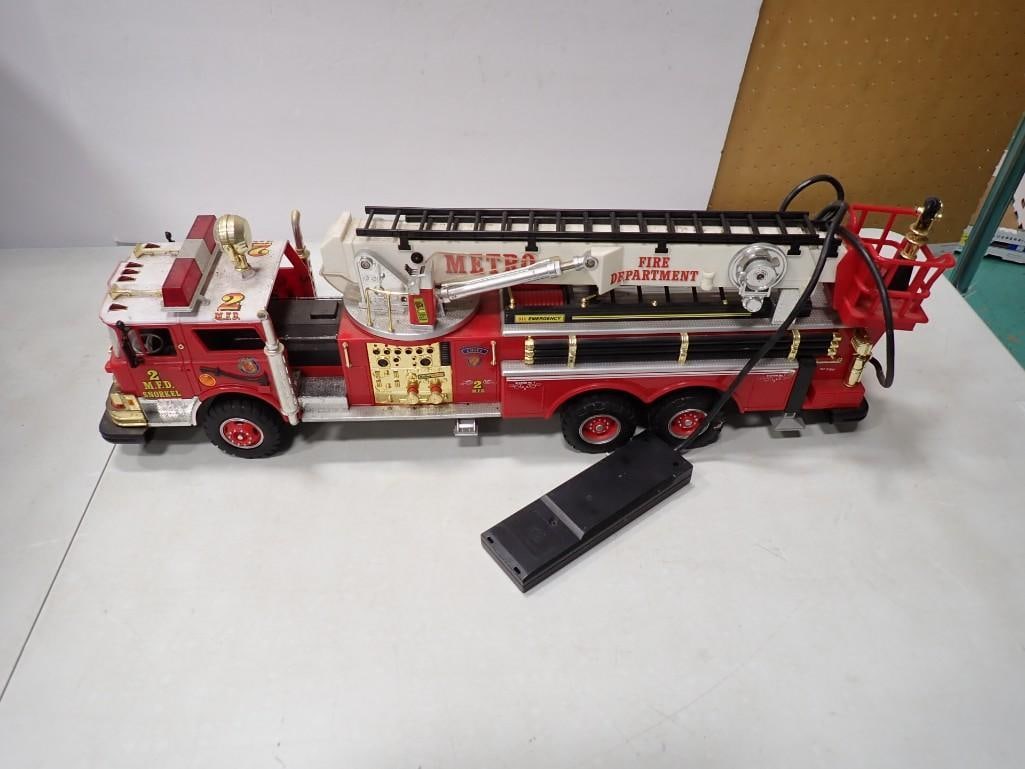 Large Battery Operated Firetruck with wired remote: Large Battery Operated Firetruck with wired remote All pictures are considered part of the description and should be examined carefully by bidders. Live Auctioneers is now offering Live Shipping throu