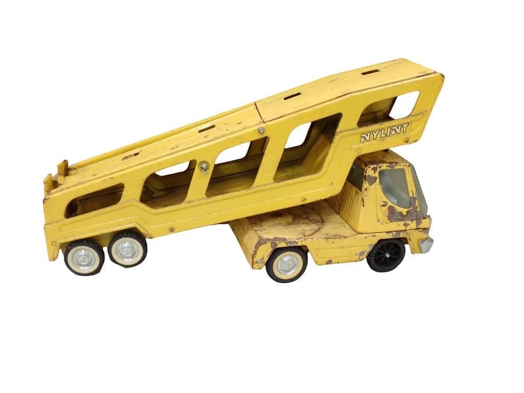 Vintage Nylint Yellow Car Hauler Truck Pressed Steel: Vintage Nylint Yellow Car Hauler Truck Pressed Steel. Condition: played with, has some rust and chipped paint, etc. All pictures are considered part of the description