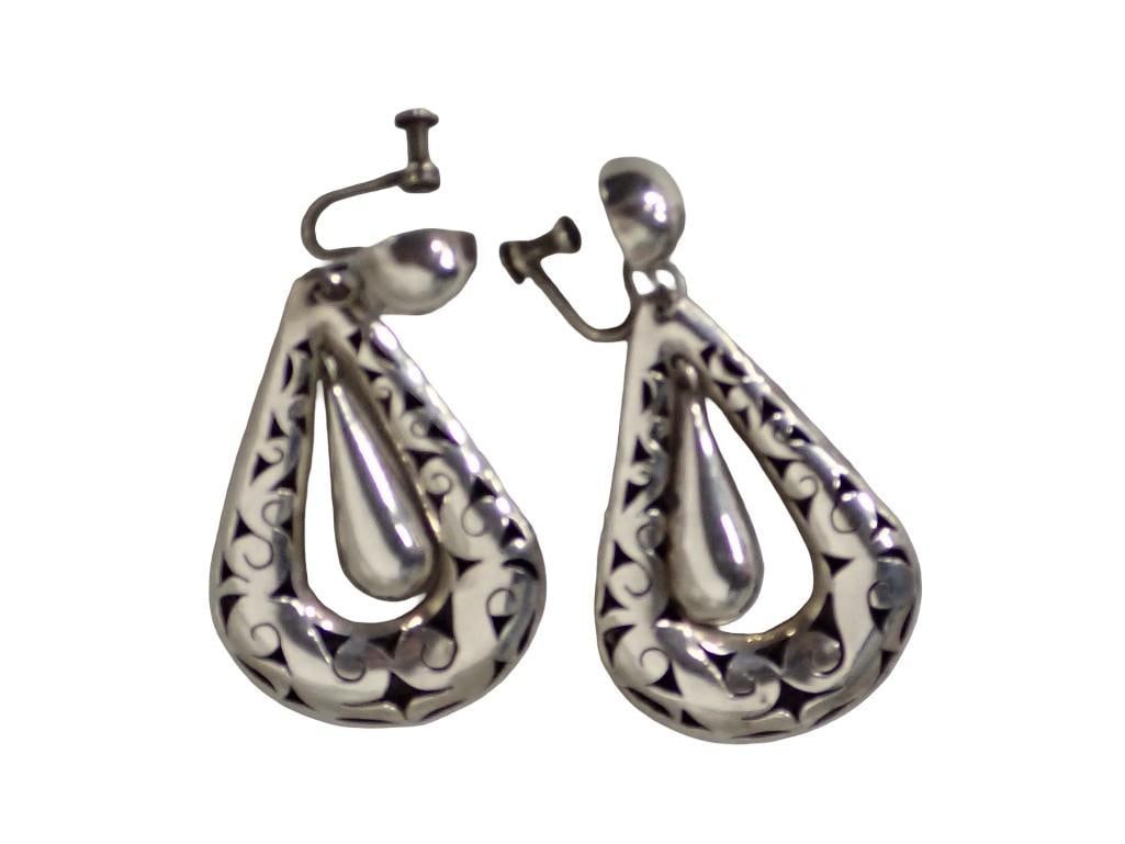 Pair of Mexican Sterling Silver Earrings. Openwork pear shape mounts with pear shaped interior drops: Pair of Mexican sterling silver earrings. Openwork pear shape mounts with?pear shaped interior drops, screwback mountings? Height: 2.25"?Weight:?.35 ozt? Dime is shown for a size comparison only