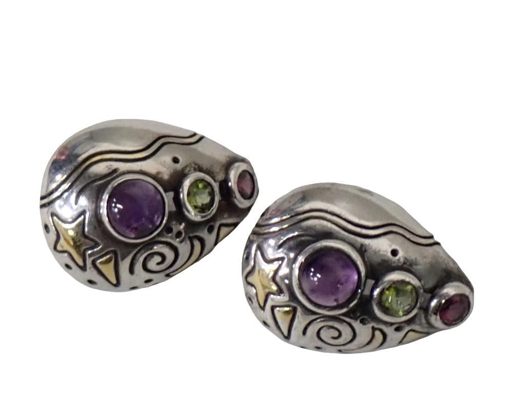 Pair of Yellow Gold, Sterling Silver, Amethyst, Peridot and Garnet Earrings. Pear Shaped Openwork si: Pair of yellow gold, sterling silver, amethyst, peridot and garnet earrings. Pear shaped openwork silver and gold mounts each contain one bezel set round cabochon amethyst, one faceted peridot and one