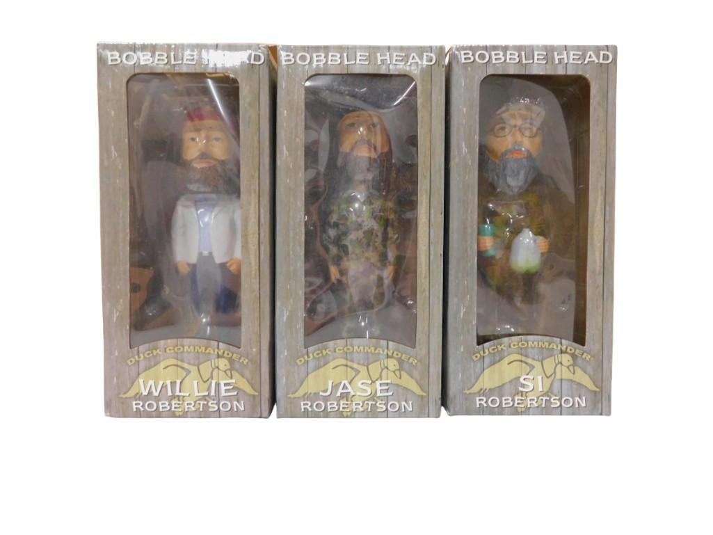 3 Duck Dynasty Bobble Heads Duck Commander Wille Robertson, Jase and Si: 3 Duck Dynasty Bobble Heads Duck Commander Wille Robertson, Jase and Si All pictures are considered part of the description and should be examined carefully by bidders. Live Auctioneers is now offerin