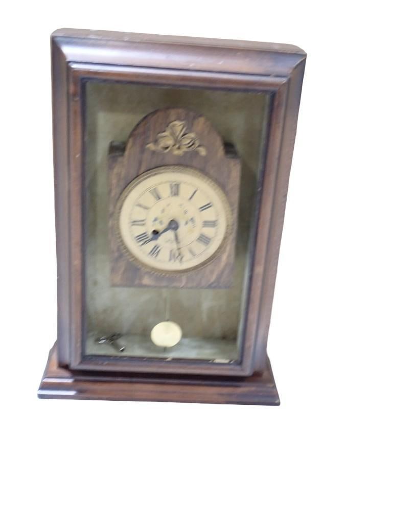 Wind Up Clock Inside a Case: Wind Up Clock Inside a Case Condition: does not work. Made from various parts and pieces of other clocks. All pictures are considered part of the description and should be examined