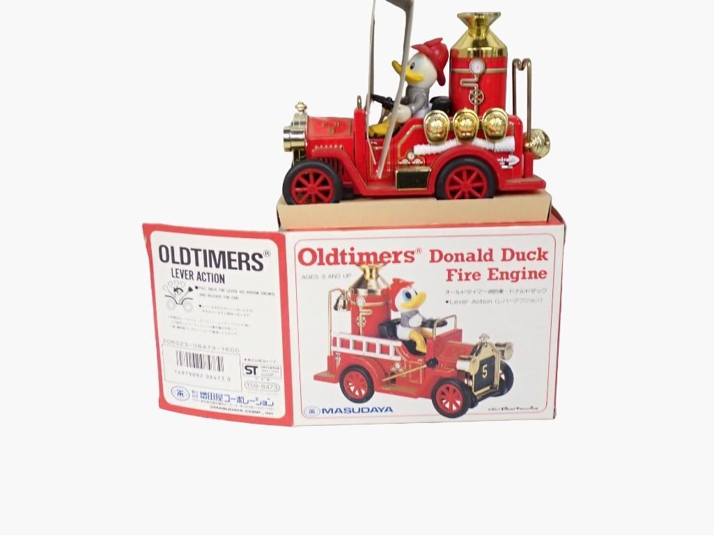 Vtg 1985 Masudaya Oldtimers Disney Donald Duck Fire Engine Lever Action Tin Toy in Original Box: Vintage 1985 Masudaya Oldtimers Disney Donald Duck Fire Engine Lever Action Tin Toy in Original Box All pictures are considered part of the description and should be examined carefully by bidders. L