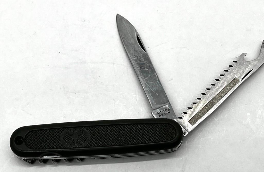 German Bundeswehr Folding Knife Aitor Spain 2 Blade/ Saw: German Bundeswehr folding knife Aitor Spain 2 blade/ saw - minimal wear 3" blade All pictures are considered part of the description and should be examined carefully by bidders. Live Auctioneers