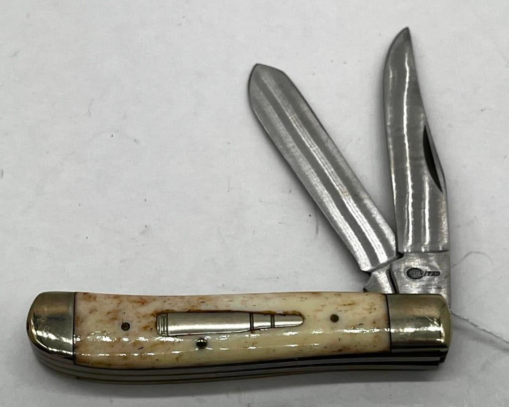 United UC 555 2 Blade Pocket Knife, Inlaid Bullet: United UC 555 2 blade pocket knife, inlaid bullet - never used 2.5" blade All pictures are considered part of the description and should be examined carefully by bidders. Live Auctioneers is now