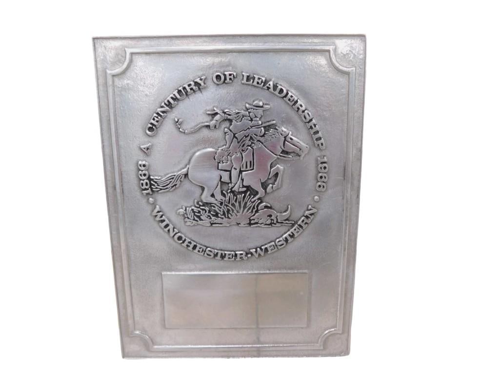 Winchester Western A Century of Leadership 1866-1966 Metal Plaque: Winchester Western A Century of Leadership 1866-1966 Metal Plaque All pictures are considered part of the description and should be examined carefully by bidders. Live Auctioneers is now offering Live