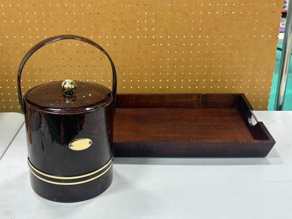 George Briard Ice bucket and a wooden serving tray with metal handles: George Briard Ice bucket and a wooden serving tray with metal handles All pictures are considered part of the description and should be examined carefully by bidders. Live Auctioneers is now offerin