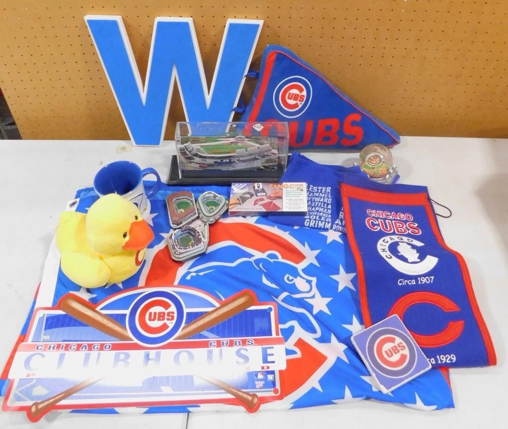 Chicago Cubs Lot including W, Ducky, Banners, Collectibles, Mug, Wall Hangings, etc.: Chicago Cubs Lot including W, Ducky, Banners, Collectibles, Mug, Wall Hangings, etc. All pictures are considered part of the description and should be examined carefully by bidders. Live Auctioneers i