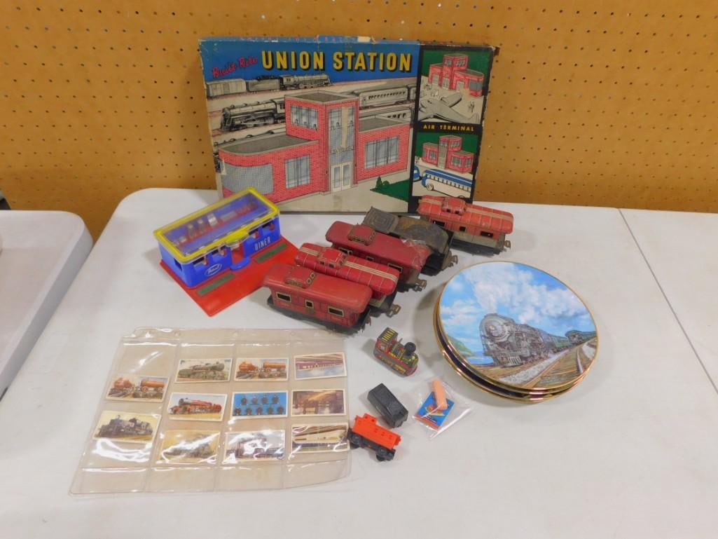 Assorted Train Lot including Built-Rite Union Station, Train Cars, Plates, Tobacco Cards, etc.: Assorted Train Lot including Built-Rite Union Station, Train Cars, Plates, Tobacco Cards, etc. All pictures are considered part of the description and should be examined carefully by bidders. Live Auc