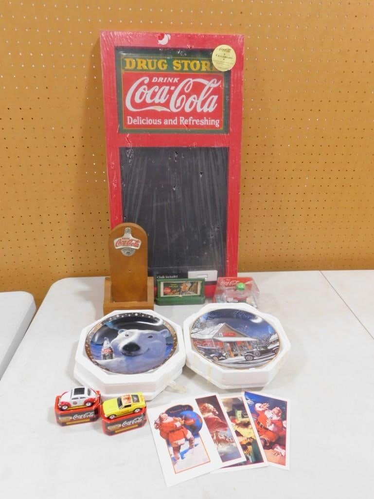 Coca Cola Lot including Chalkboard, Bottle Opener, Collector Plates, etc.: Coca Cola Lot including Chalkboard, Bottle Opener, Collector Plates, etc. All pictures are considered part of the description and should be examined carefully by bidders. Live Auctioneers is now offer
