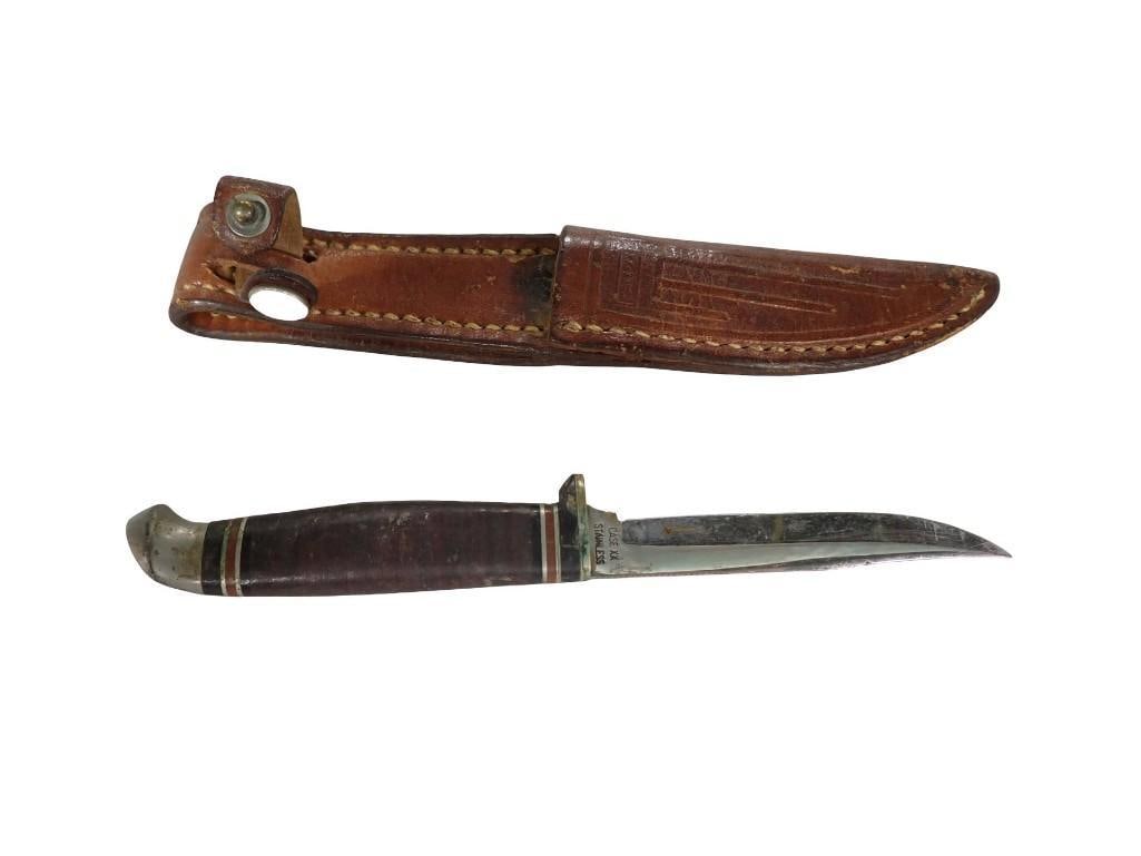 Small Case XX Knife in a Leather Sheath: Small Case XX Sheath Knife in a Leather Sheath All pictures are considered part of the description and should be examined carefully by bidders. Live Auctioneers is now offering Live Shipping through