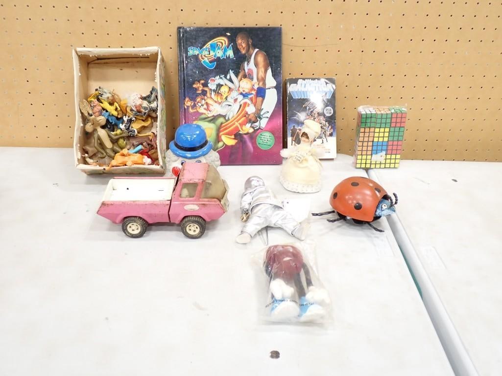 Lot of Toys incl Space Jam Book, California Raisin, Tonka Truck, Etc: Lot of Toys including Space Jam Book, California Raisin, Tonka Truck, Etc All pictures are considered part of the description and should be examined carefully by bidders. Live Auctioneers is now off