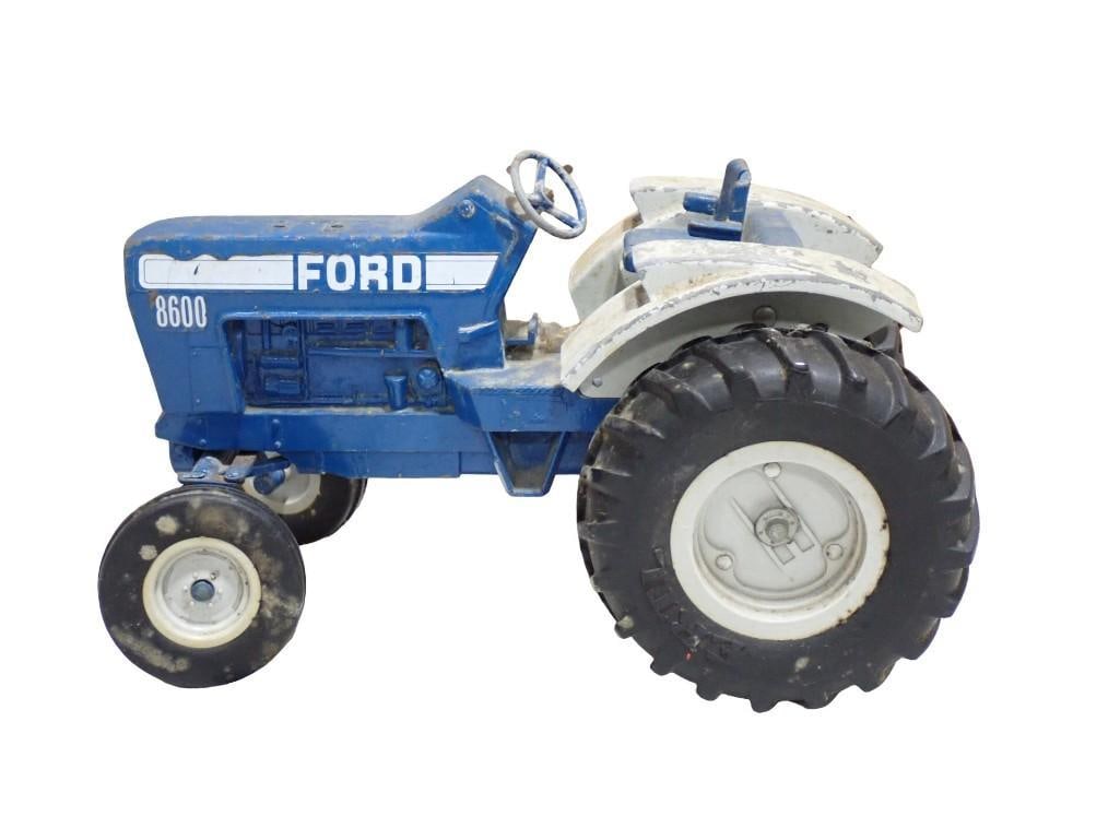 Vintage Ertl Die Cast Metal Ford 8600 Toy Tractor: Vintage Ertl Die Cast Metal Ford 8600 Toy Tractor All pictures are considered part of the description and should be examined carefully by bidders. Live Auctioneers is now offering Live Shipping thro