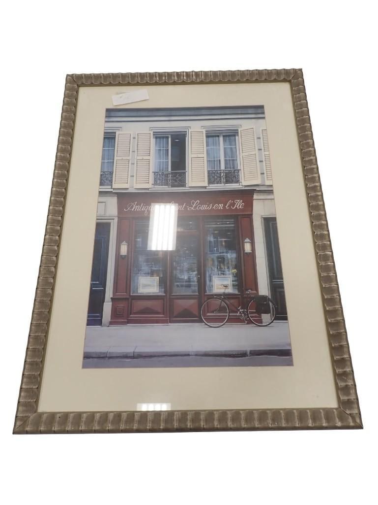 Framed Print of a French Antique Store with a Bicycle in Front: Framed Print of a French Antique Store with a Bicycle in Front All pictures are considered part of the description and should be examined carefully by bidders. Live Auctioneers is now offering Live