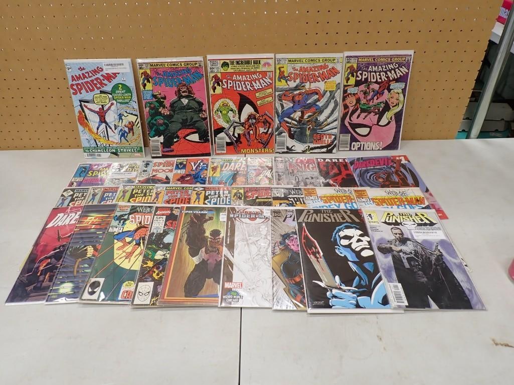 Comic Books including Amazing Spider-Man, The Punisher, Daredevil, etc.: Comic Books including Amazing Spider-Man, The Punisher, Daredevil, etc. All pictures are considered part of the description and should be examined carefully by bidders. Live Auctioneers is now offerin