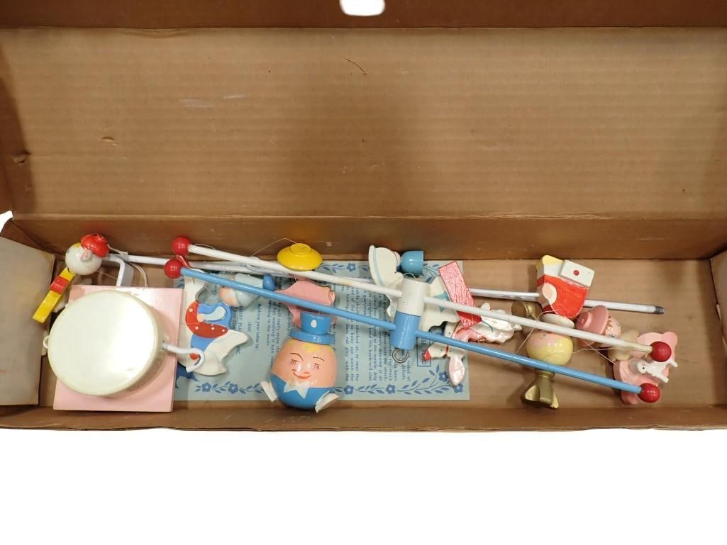Vintage Nursery Rhyme Mobile in Original Box Handpainted Mobile by Irmi: Vintage Nursery Rhyme Mobile in Original Box Handpainted Mobile by Irmi All pictures are considered part of the description and should be examined carefully by bidders. Live Auctioneers is now offerin