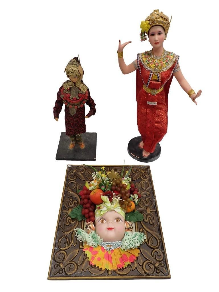 2 Asian Style Figurines or Dolls and a Wall Hanging of a Person with a Fruit Hat: 2 Asian Style Figurines or Dolls and a Wall hanging of a Person with a Fruit Hat All pictures are considered part of the description and should be examined carefully by bidders. Live Auctioneers is no