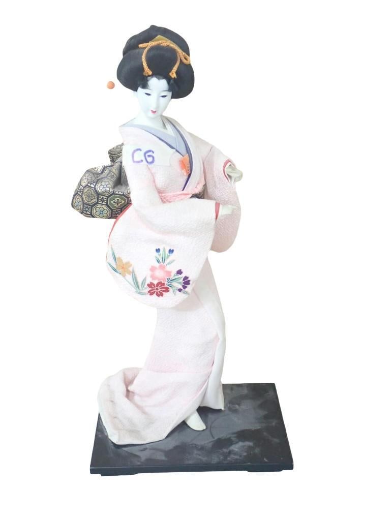 Japanese Geisha Doll on a stand: Japanese Geisha Doll on a stand All pictures are considered part of the description and should be examined carefully by bidders. Live Auctioneers is now offering Live Shipping through them. This is an