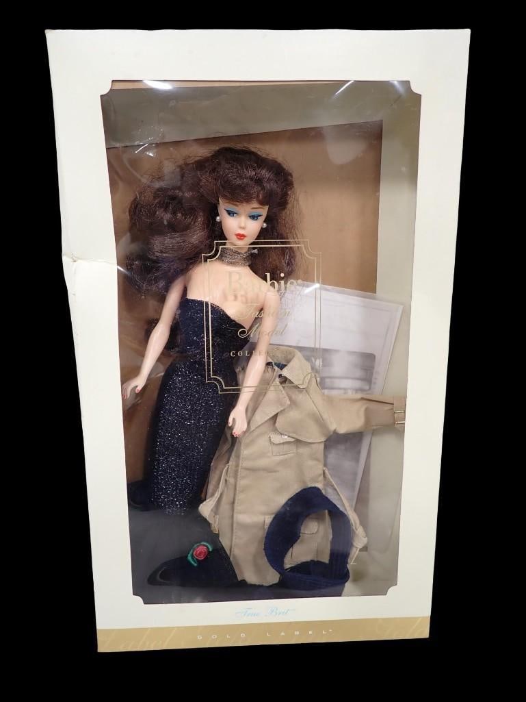 Barbie Special Edition Solo in the Spotlight 1994 Reproduction Doll with Brunette Hair: Barbie Special Edition Solo in the Spotlight 1994 Reproduction Doll with Brunette Hair and a True Brit Barbie Jacket and Scarf. Comes with the True Brit Accessory Box, which is NOt the original 