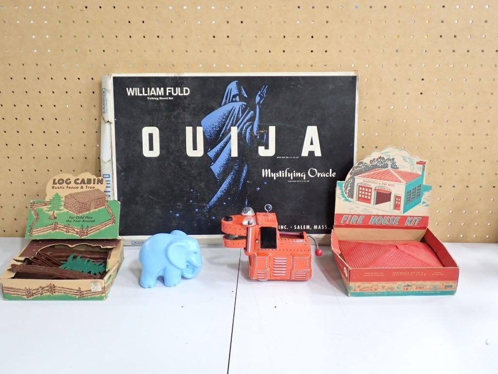 Toy Lot including Log Cabin and Fire House Kits, Ouija Board, Litho Toy Dog, Elephant: Toy Lot including Log Cabin and Fire House Kits, Ouija Board, Litho Toy Dog, Elephant All pictures are considered part of the description and should be examined carefully by bidders. Live Auctioneers 