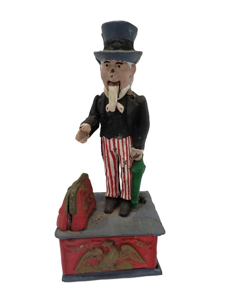 Vintage Uncle Sam Cast Iron Patriotic Mechanical Bank: Vintage Uncle Sam Cast Iron Patriotic Mechanical Bank All pictures are considered part of the description and should be examined carefully by bidders. Live Auctioneers is now offering Live Shipping th