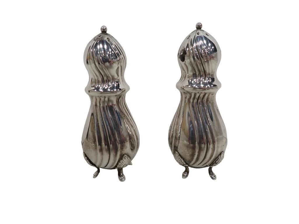 A Pair of Danish Silverplate Salt Shakers. Both are stamped "Denmark" under one of the four acanthus: A pair of Danish silver plate salt shakers. Both are stamped "Denmark" under one of the four acanthus leaf feet Height: 3 3/4" All pictures are considered part of the description and shoul