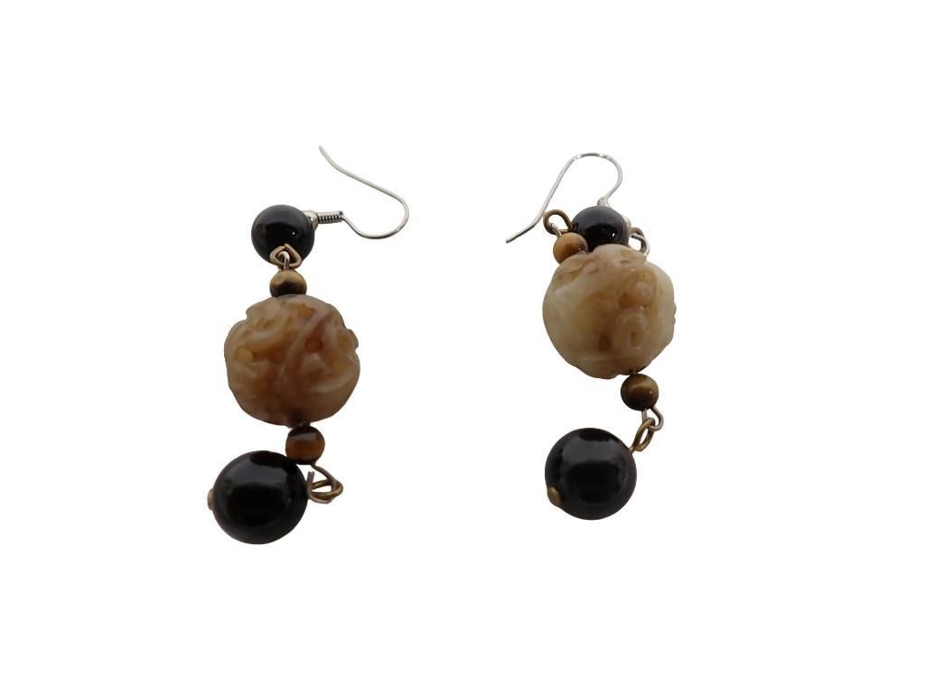 A Pair of Chinese Stone Drop earrings. Each wireback Drop Earring Mounted with One Carved Jade Bead,: A pair of Chinese stone drop earrings. Each wireback drop earring mounted with one carved jade bead, two onyx beads and two tiger's eye beads Length: 3" All pictures are considered part of the