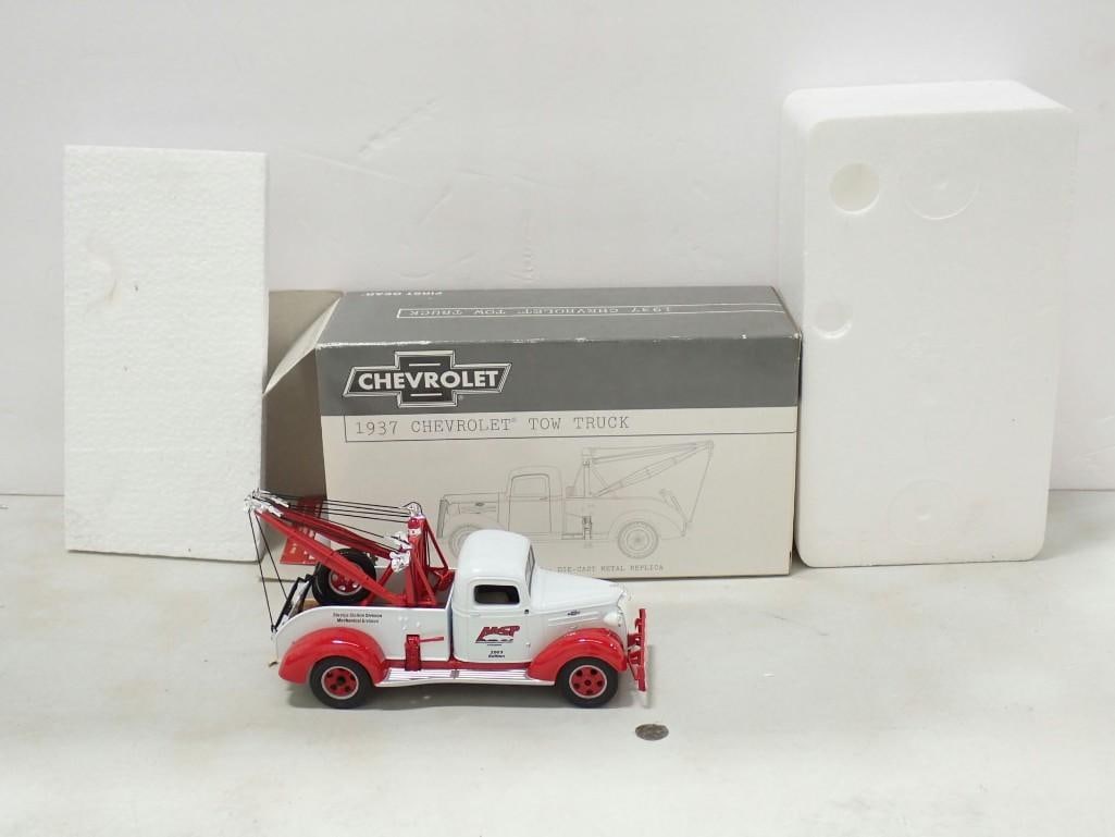 Die-Cast Metal 1937 Chevrolet Tow Truck Model - First Gear with Box: Die-Cast Metal 1937 Chevrolet Tow Truck Model - First Gear with Box All pictures are considered part of the description and should be examined carefully by bidders. Live Auctioneers is now offering Li