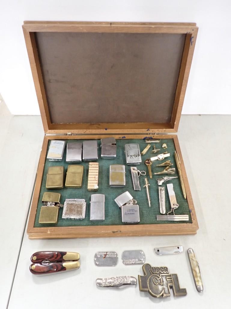Vintage Display Case full of Lighters and Tie Clips, Knives, etc.: Vintage Display Case full of Lighters and Tie Clips, Knives, etc. All pictures are considered part of the description and should be examined carefully by bidders. Live Auctioneers is now offering Live
