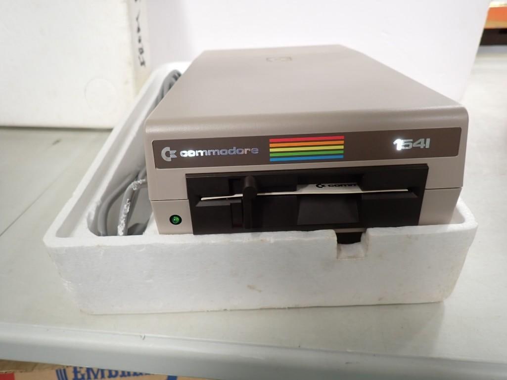 Vintage Commodore 64 Disc Drive 1541 with Box - Untested: Vintage Commodore 64 Disc Drive 1541 with Box - Untested All pictures are considered part of the description and should be examined carefully by bidders. Live Auctioneers is now offering Live Shipping
