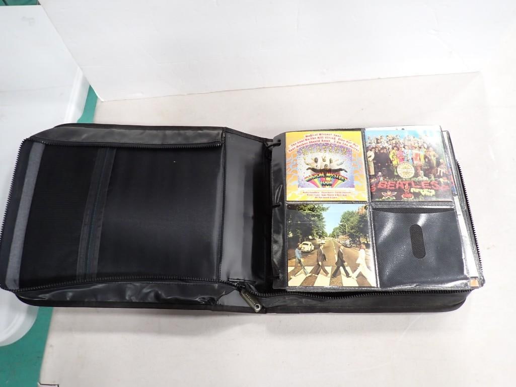 Case full of assorted CDs including Beatles: Case full of assorted CDs including Beatles All pictures are considered part of the description and should be examined carefully by bidders. Live Auctioneers is now offering Live Shipping through