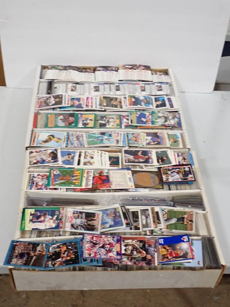Large Lot full of Assorted Basketball, Football, Baseball Cards, etc.: Large Lot full of Assorted Basketball, Football, Baseball Cards, etc. All pictures are considered part of the description and should be examined carefully by bidders. Live Auctioneers is now offering 