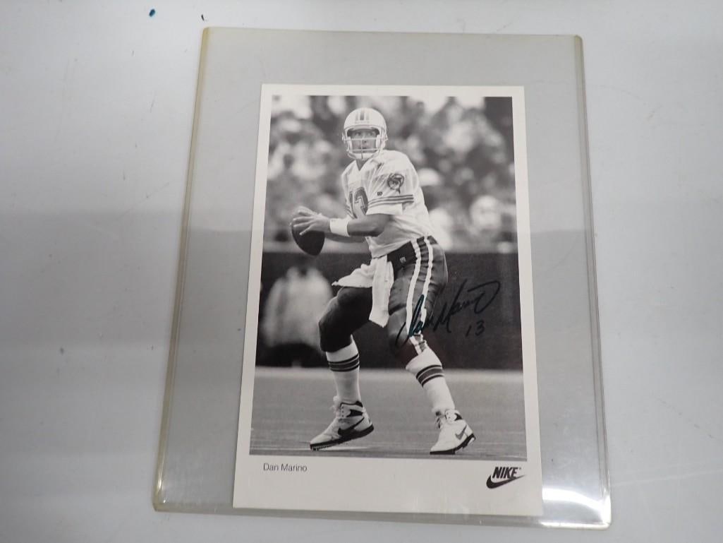 Dan Marino Autographed Nike Photo - no COA: Dan Marino Autographed Nike Photo - no COA All pictures are considered part of the description and should be examined carefully by bidders. Live Auctioneers is now offering Live Shipping through them.