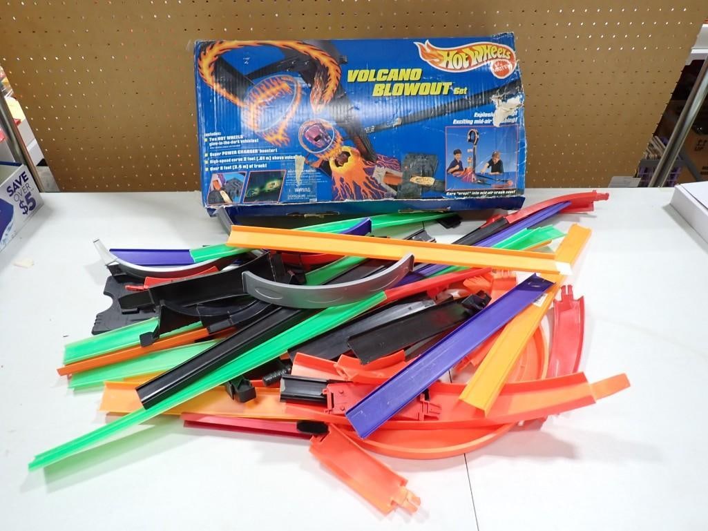 Hot Wheels Tracks and a Volcano Blowout Set Box - comes with everything as shown: Hot Wheels Tracks and a Volcano Blowout Set Box - comes with everything as shown All pictures are considered part of the description and should be examined carefully by bidders. Live Auctioneers is no