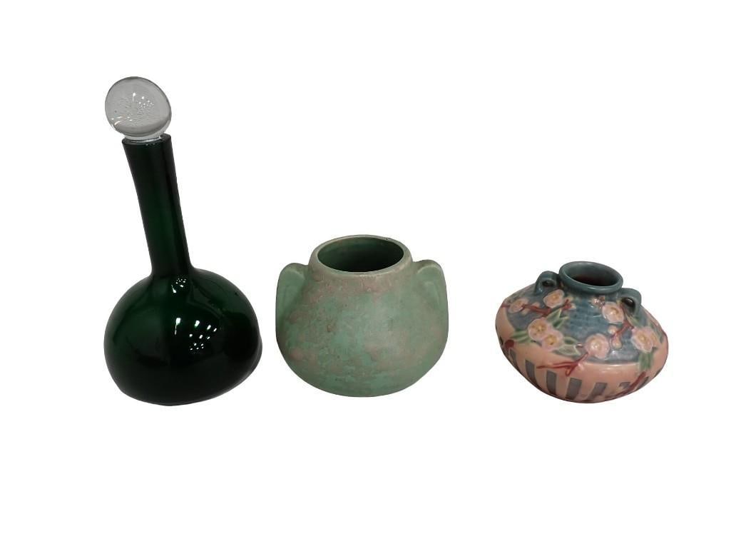 2 Vases incl vintage Brush McCoy Art Vellum Vase and a Roseville Pottery Cherry Blossom Vase: 2 Vases incl vintage Brush McCoy Art Vellum Vase and a Roseville Pottery Cherry Blossom Vase plus a green glass bottle with a clear stopper All pictures are considered part of the description and shou