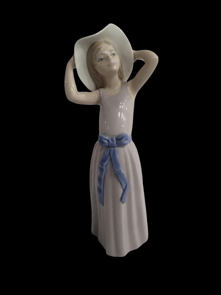 Lladro Porcelain Figurine "Coy" #5011: Lladro Porcelain Figurine "Coy" #5011 All pictures are considered part of the description and should be examined carefully by bidders. Live Auctioneers is now offering Live Shipping through th