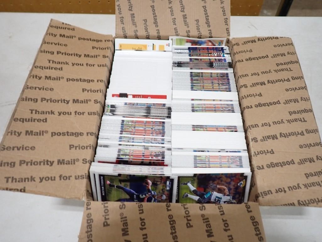 Box full of sports cards including Baseball and Football: Box full of sports cards including Baseball and Football All pictures are considered part of the description and should be examined carefully by bidders. Live Auctioneers is now offering Live Shipping