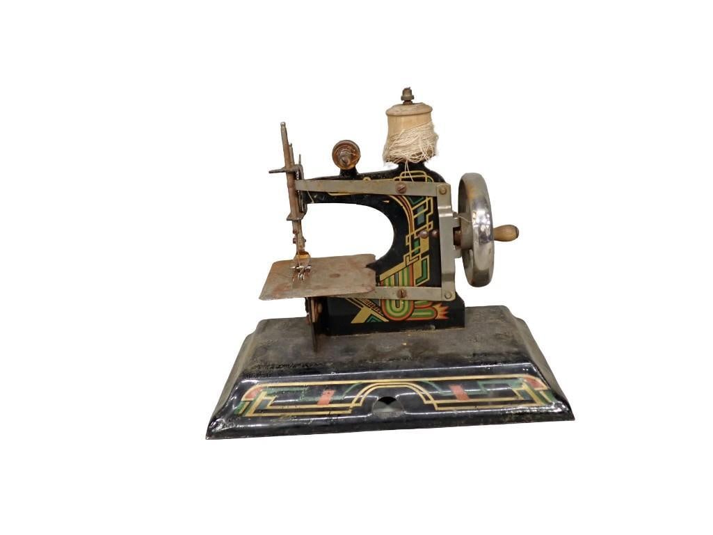 Vintage Casige Model 116 Toy Sewing Machine: Vintage Casige Model 116 Toy Sewing Machine All pictures are considered part of the description and should be examined carefully by bidders. Live Auctioneers is now offering Live Shipping through them