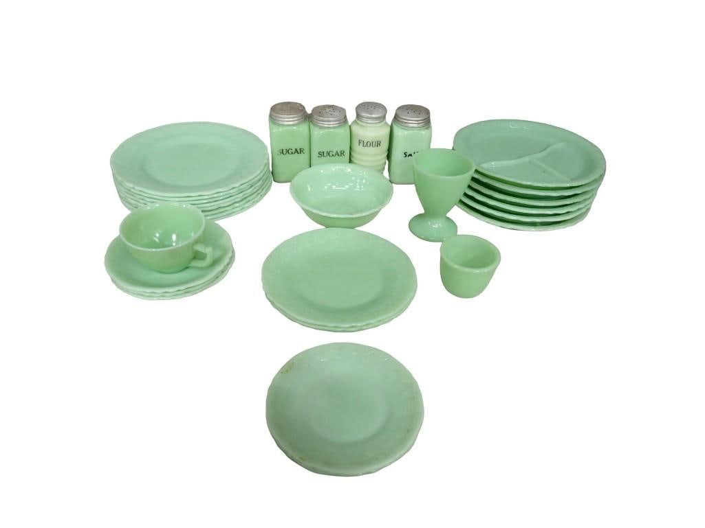 Lot of Vintage Jadeite Glass including Spice Jars, Plates, Cups, etc - it glows: Lot of Vintage Jadeite Glass including Spice Jars, Plates, Cups, etc. It glows. All pictures are considered part of the description and should be examined carefully by bidders. Live Auctioneers 