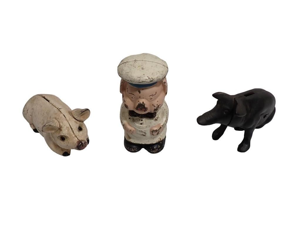 3 Cast Iron Toy Piggy Banks incl Chef Pig, Etc: 3 Cast Iron Toy Piggy Banks incl Chef Pig, Etc All pictures are considered part of the description and should be examined carefully by bidders. Live Auctioneers is now offering Live Shipping through t