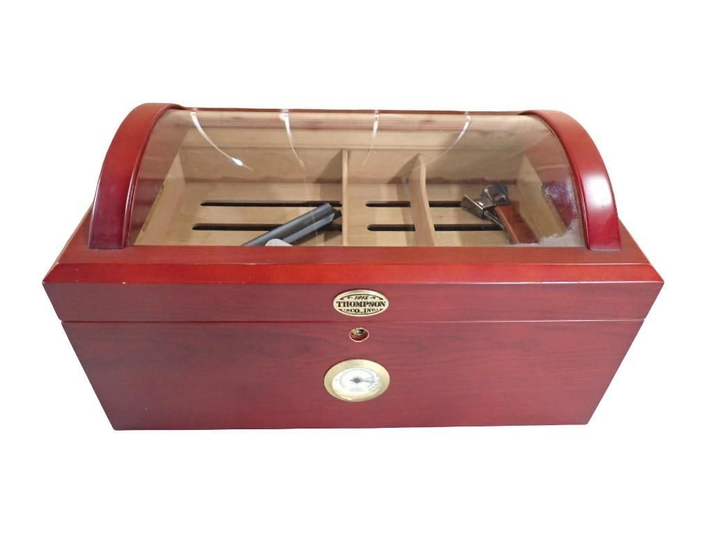 Thompson 1915 cherrywood arch barrel-top humidor with curved glass lid and Hygrometer: Thompson 1915 cherrywood arch barrel-top humidor with curved glass lid and Hygrometer All pictures are considered part of the description and should be examined carefully by bidders. Live Auctioneers