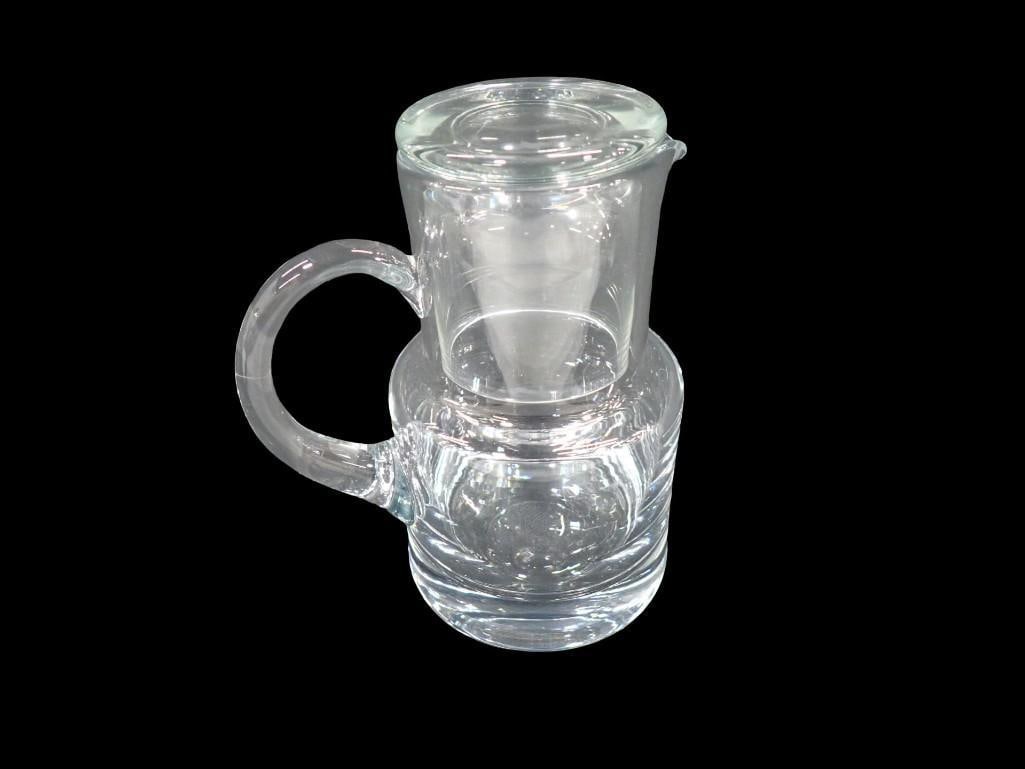 Tiffany and Co Glass bedside night water carafe with a matching cup lid: Tiffany and Co Glass bedside night water carafe with a matching cup lid All pictures are considered part of the description and should be examined carefully by bidders. Live Auctioneers is now offerin
