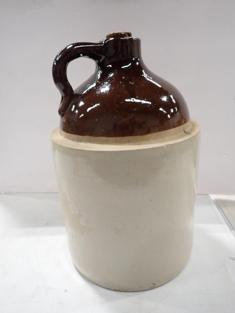 Two Tone Stoneware Moonshine or Whiskey Jug: Two Tone Stoneware Moonshine or Whiskey Jug All pictures are considered part of the description and should be examined carefully by bidders. Live Auctioneers is now offering Live Shipping through them