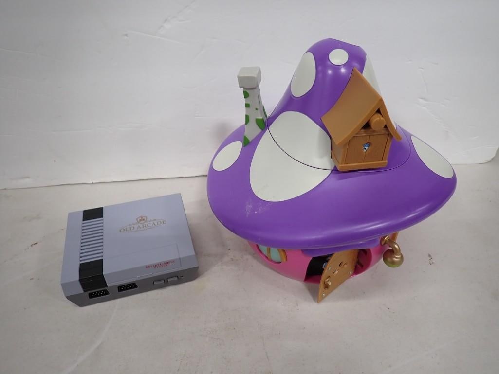 Cinemark Smurfs Smurfette House Popcorn Bucket and Retro Gaming System: Cinemark Smurfs Smurfette House Popcorn Bucket and Retro Gaming System All pictures are considered part of the description and should be examined carefully by bidders. Live Auctioneers is now