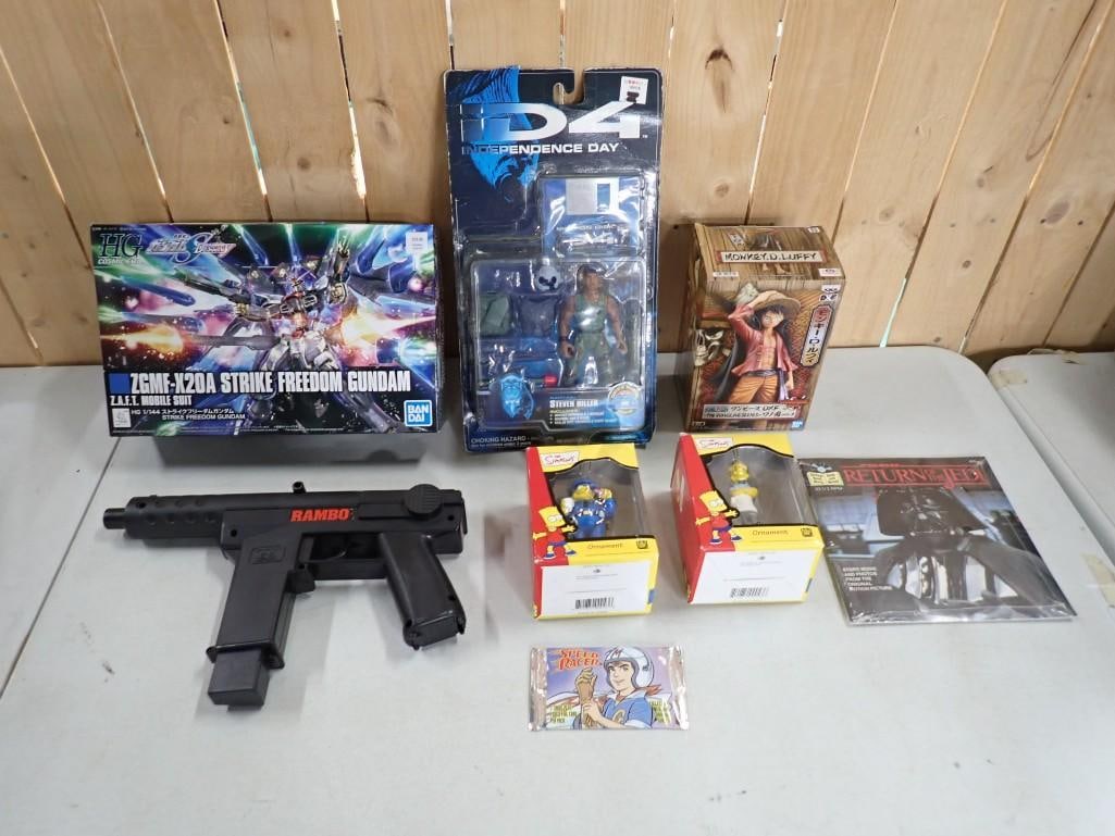 Toy Lot including The Simpsons, Rambo Gun, Speed Racer, Star Wars, Bandai Gundam, ID4, Monkey D. Luf: Toy Lot including The Simpsons, Rambo Gun, Speed Racer, Star Wars, Bandai Gundam, ID4, Monkey D. Luffy All pictures are considered part of the description and should be examined carefully by bidders. 