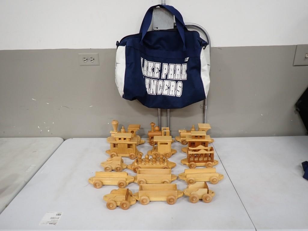 Lot of Wooden Toy Trains / Cars, Lake Park Lancers Bag: Lot of Wooden Toy Trains / Cars, Lake Park Lancers Bag All pictures are considered part of the description and should be examined carefully by bidders. Live Auctioneers is now offering Live Shipping t